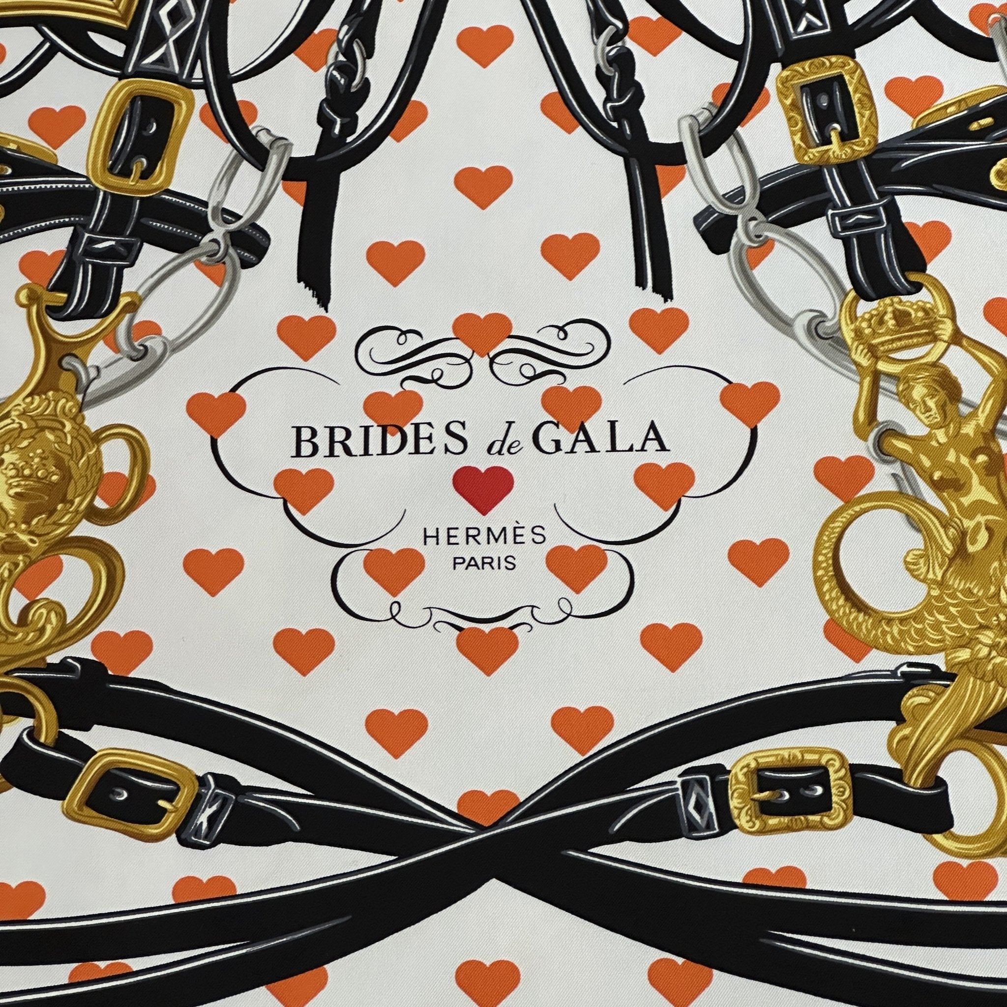 coeurs orange sur fond blanc brides de gala love par hermes paris