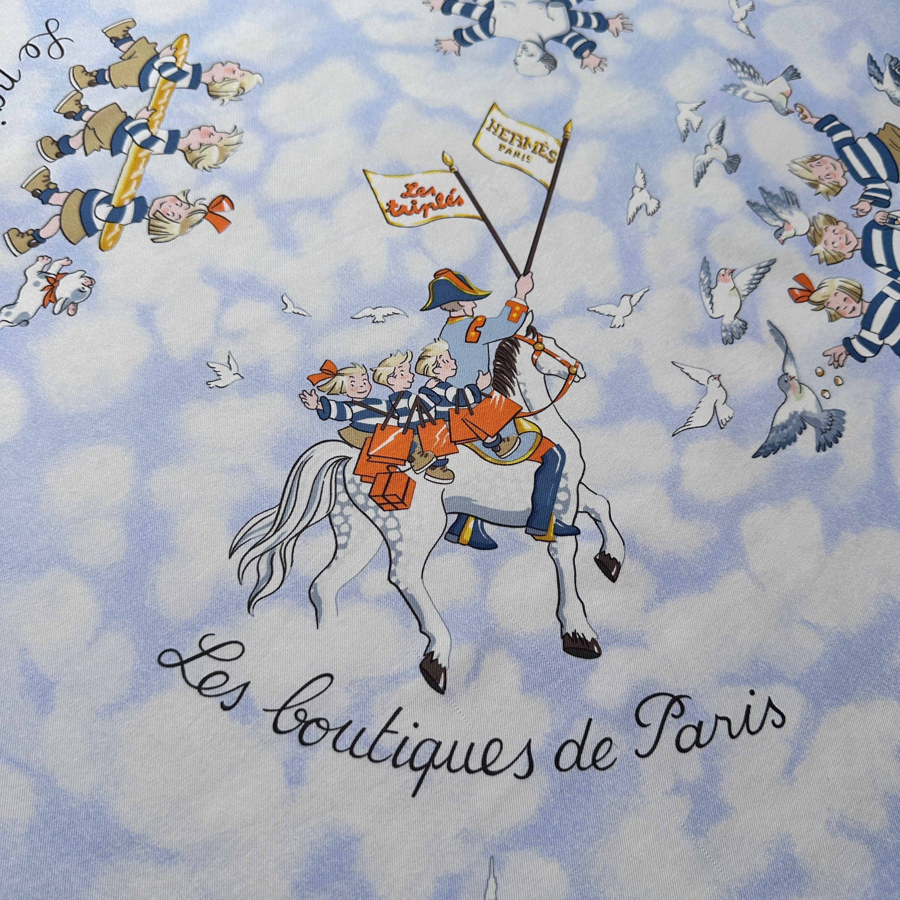 Les Triplés grimpant sur la statue équestre d'Henri IV, détail du foulard Hermès.